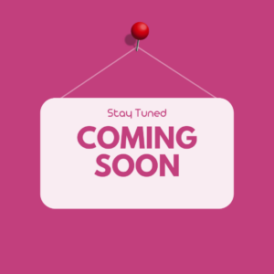Pink sign with text 'Stay Tuned, Coming Soon' pinned on a wall, indicating upcoming LGBT+ events and updates.