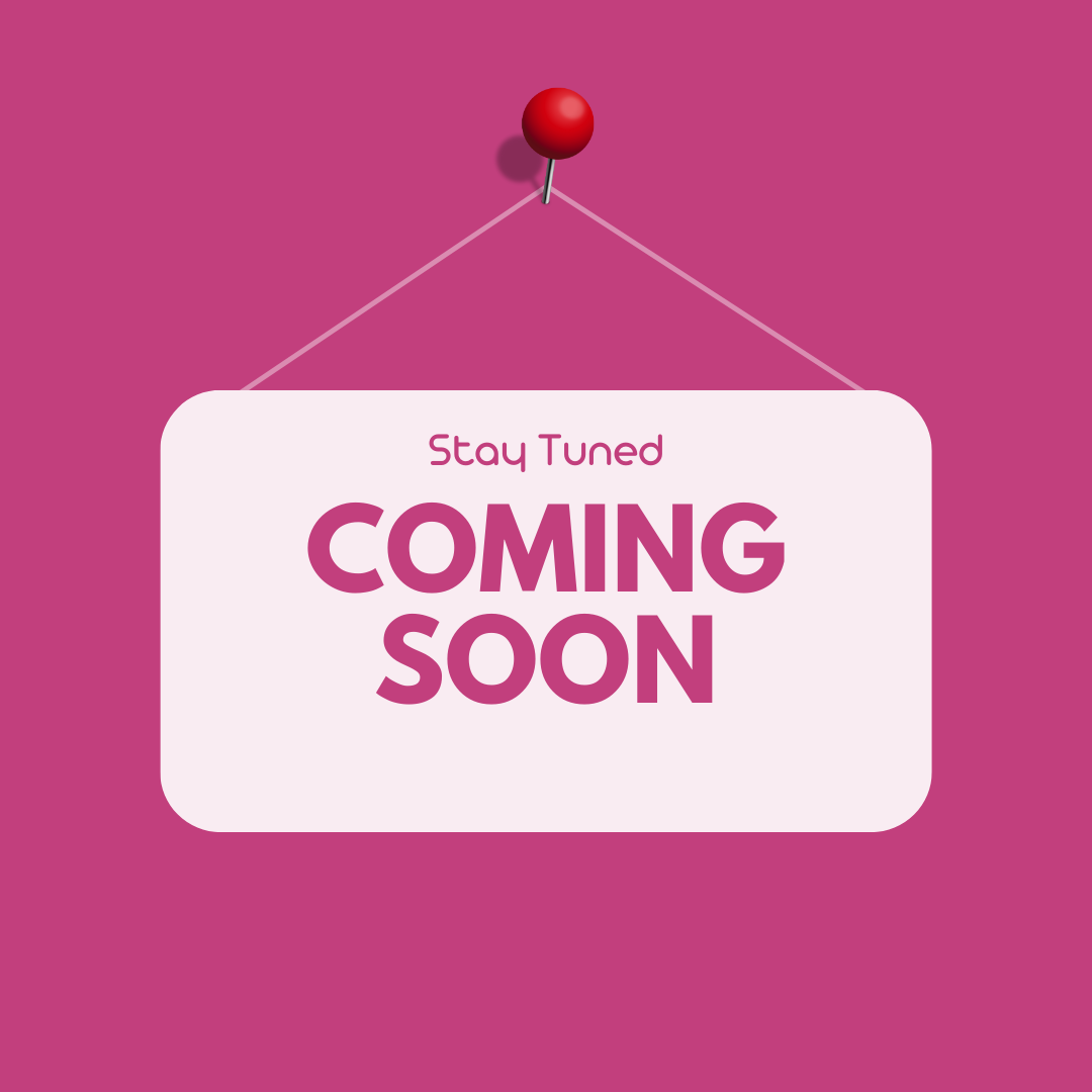 Pink sign with text 'Stay Tuned, Coming Soon' pinned on a wall, indicating upcoming LGBT+ events and updates.