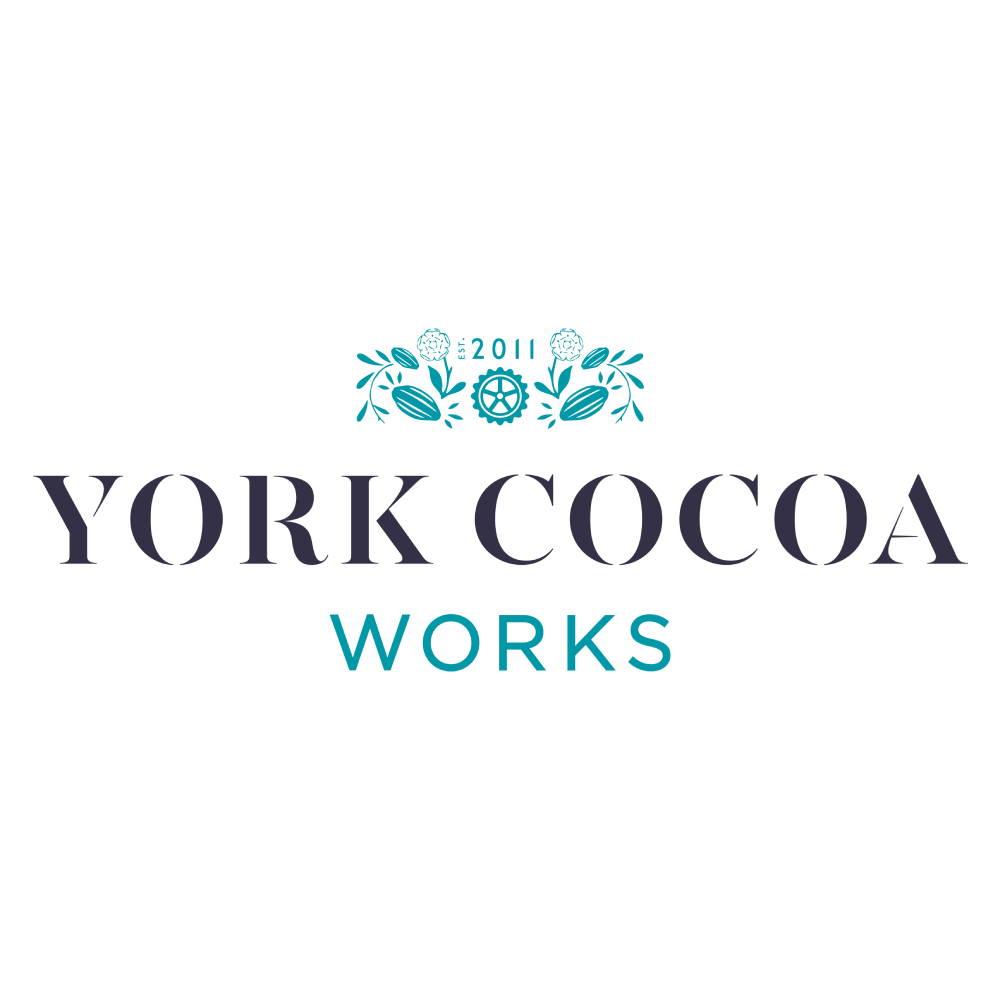 York Cocoa Works logo with gears and cocoa beans, celebrating pride with a welcoming touch.