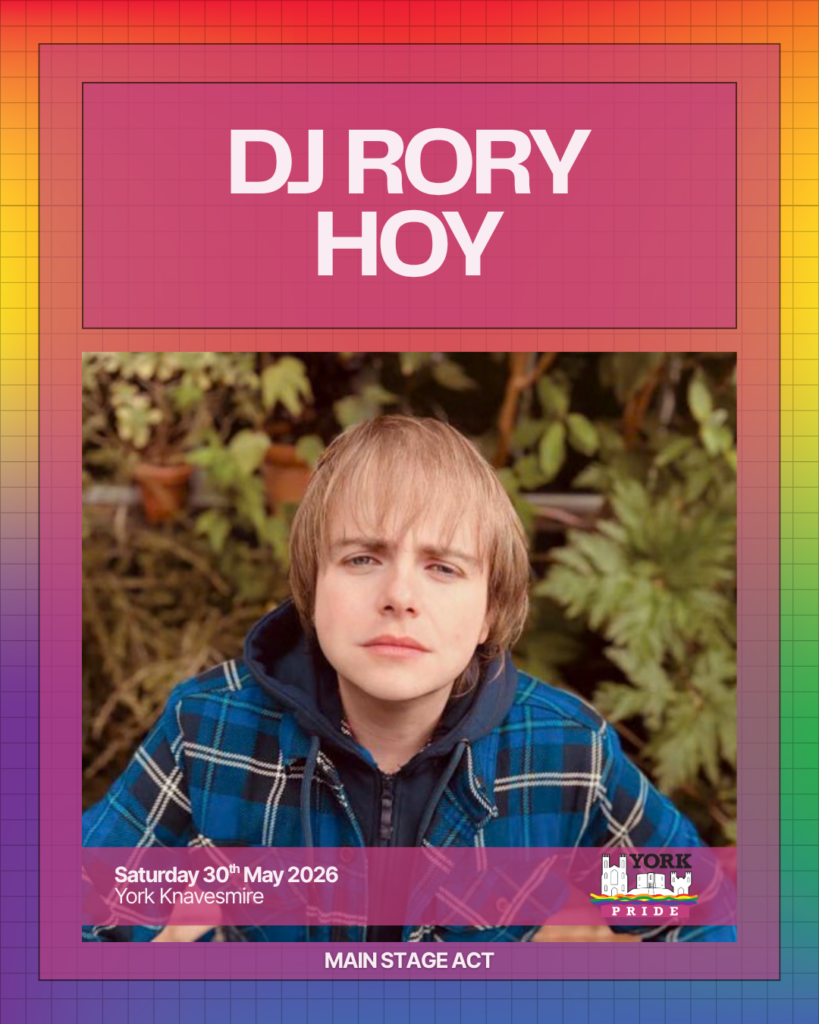 ```markdown
DJ Rory Hoy in checkered jacket at York Pride, performing on the main stage, 30th May 2026 in York Knavesmire.
```