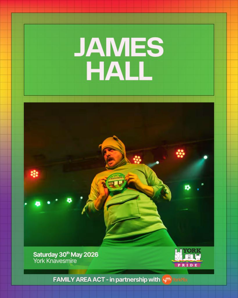 Performer on stage at York Pride 2026, wearing a green outfit under vibrant stage lights.