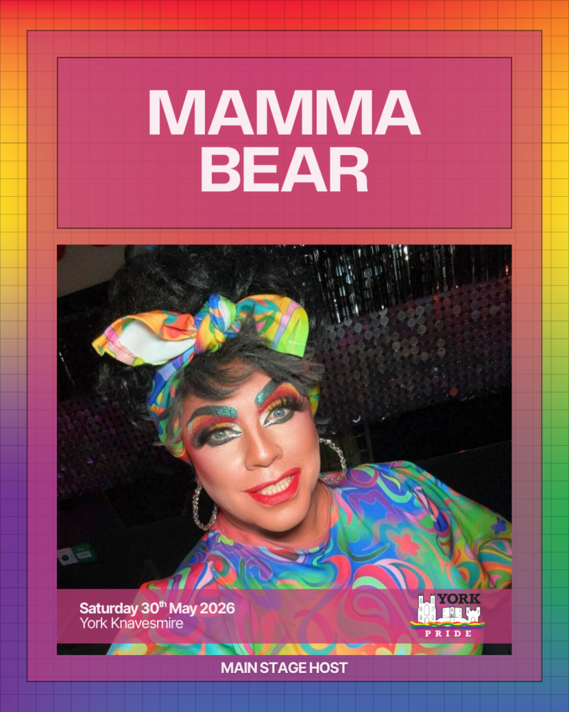 ```plaintext
Drag performer hosts York Pride 2026 main stage in vibrant outfit and makeup.
```
