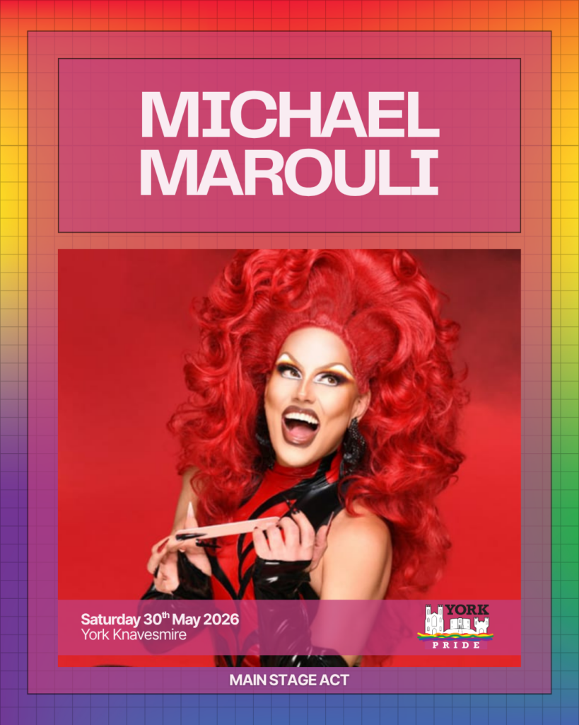 Sure! Here's a suggestion:Vibrant performer smiling with red hair, promoting York Pride main stage event, 30th May 2026 at York Knavesmire.