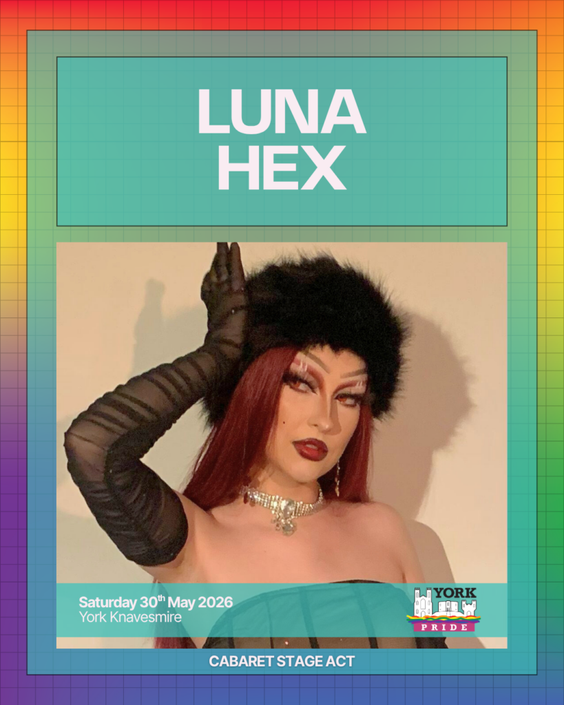 ```markdown
Performer in stylish costume and black hat poses confidently for York Pride event, scheduled for 30th May 2026.
```