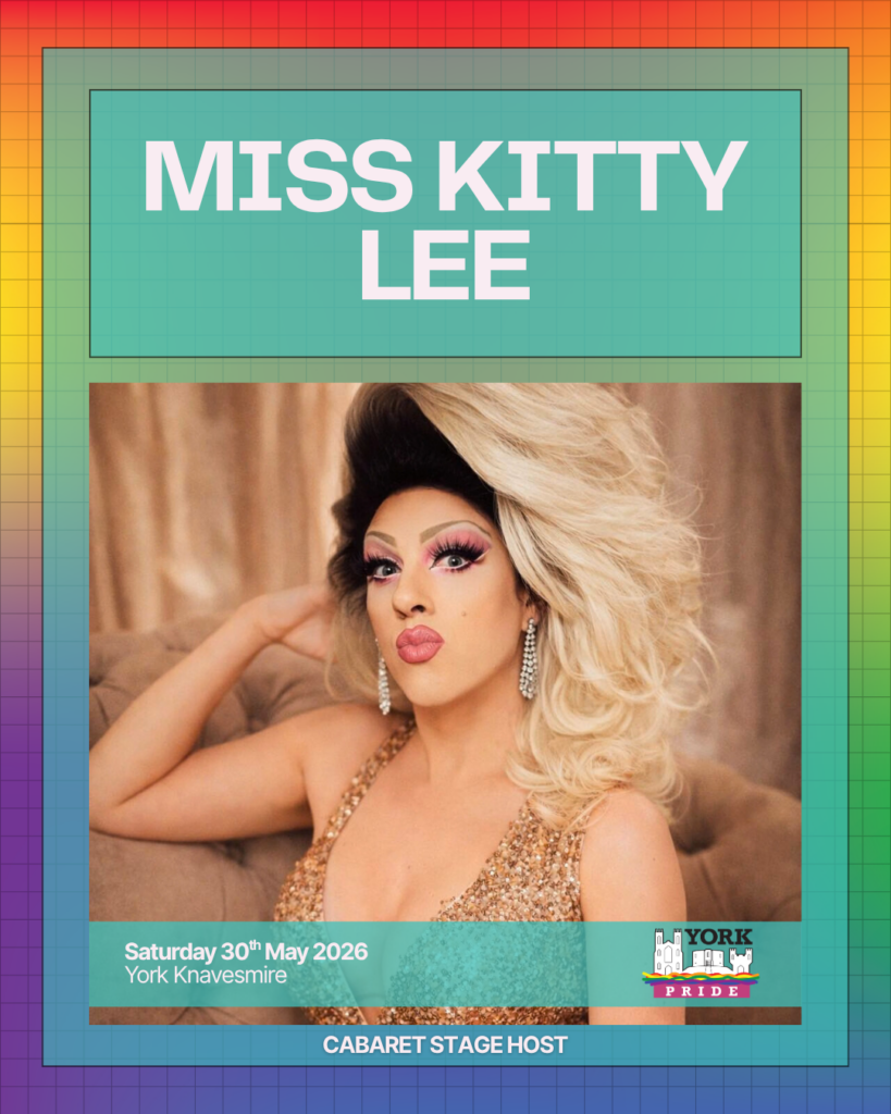 Here's a descriptive alt text for the image:Drag performer posing fabulously for York Pride 2026. Event on 30 May at York Knavesmire. Cabaret stage host.
