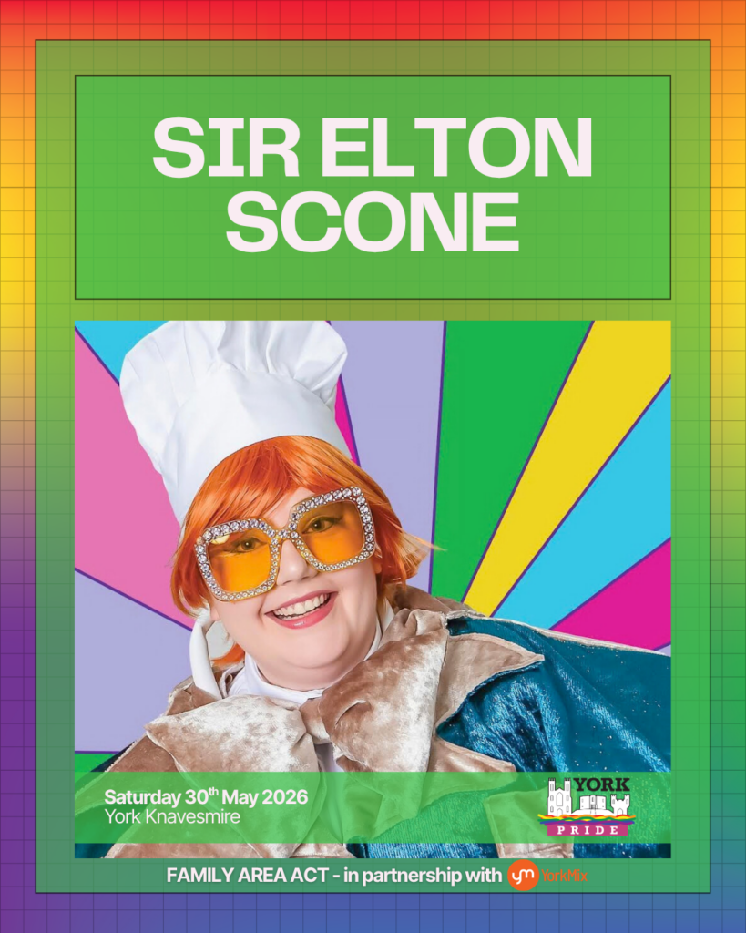 ```markdown
Performer in colourful costume and large glasses at York Pride event, 30th May 2026, York Knavesmire.
```